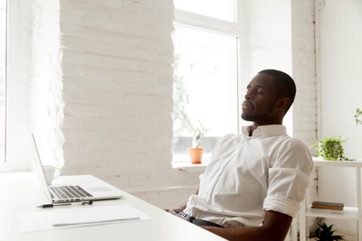 Relaxed businessman in office taking a break.