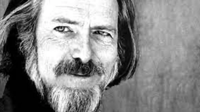 Black and white portrait of Alan Watts.